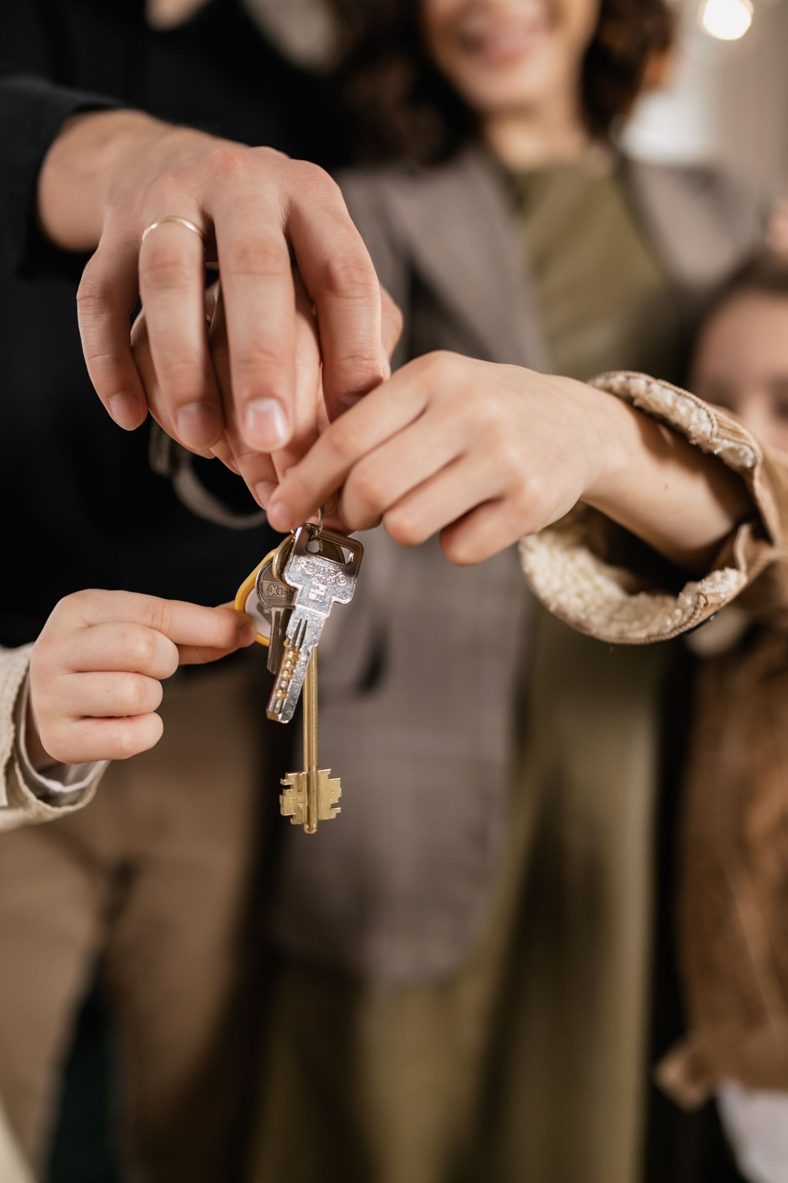 A family receiving the keys to their new home