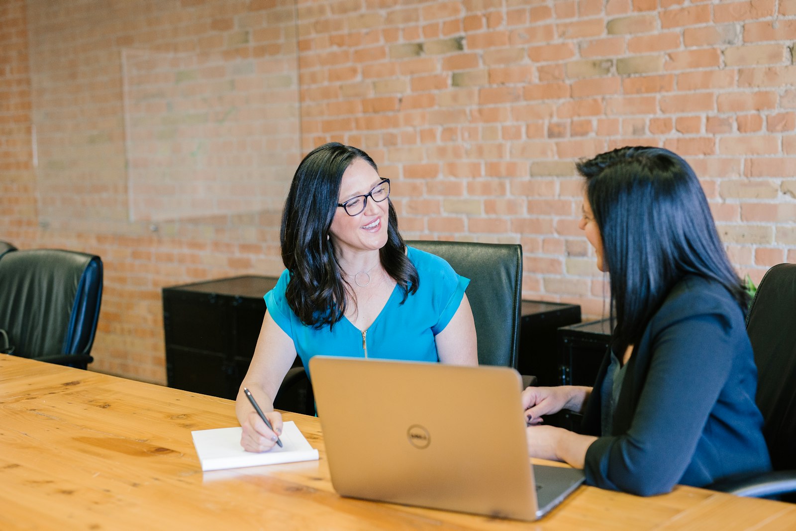 Two ELG mortgage advisors in a friendly consultation